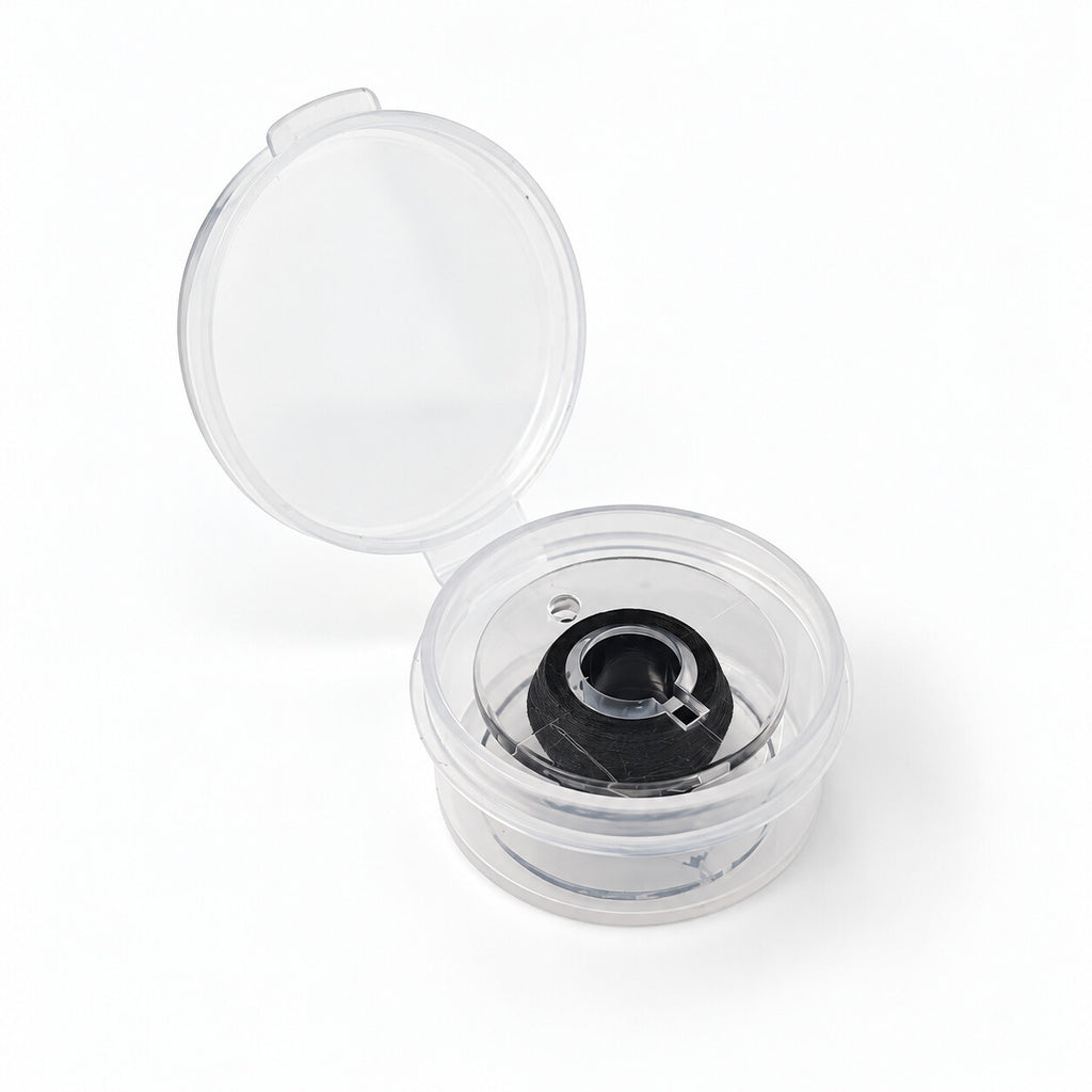 Small black elastic invisible thread spool in an open storage case