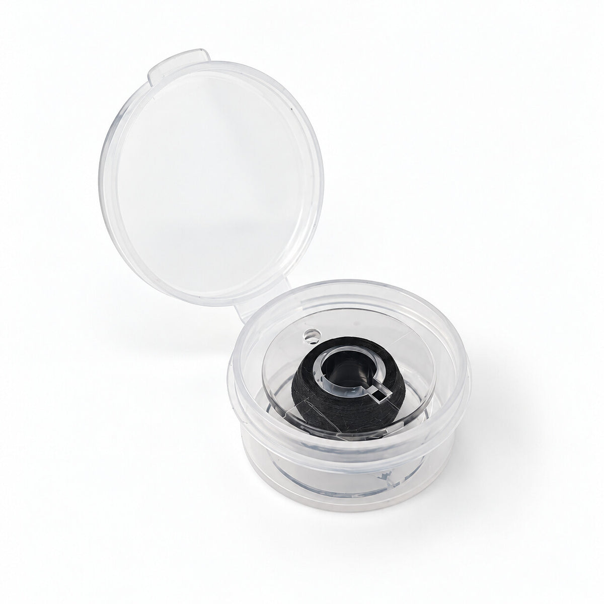 Small black elastic invisible thread spool in an open storage case